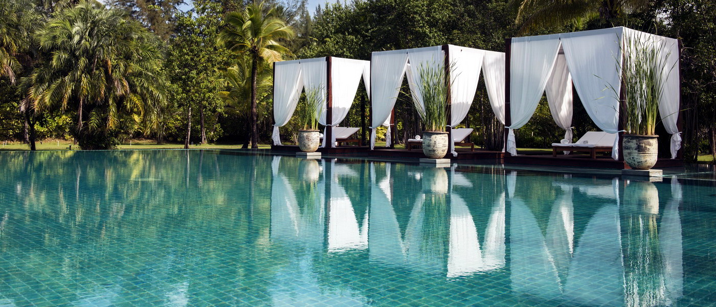 Tranquil poolside retreat with pool pavilions at The Sarojin, offering relaxation and luxury.