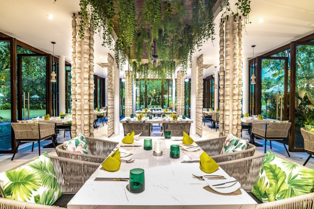 Interior view of Ficus restaurant at The Sarojin, featuring stylish decor, elegant furnishings, and ambient lighting.